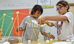 kids building with marshmallows and noodles