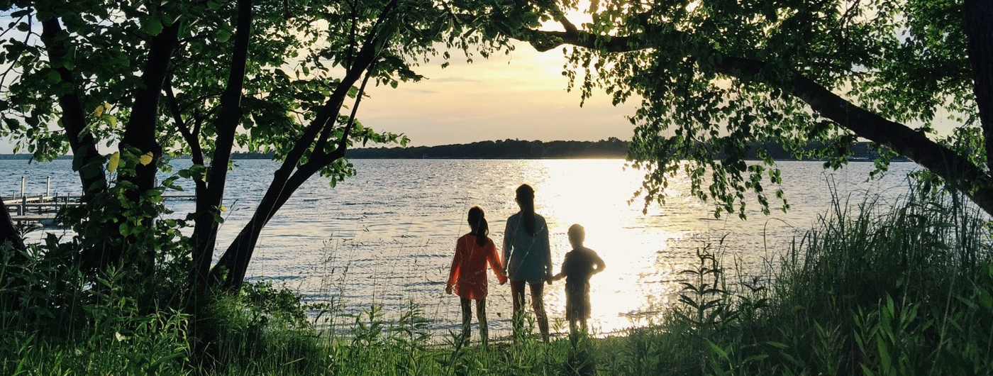 A family enjoying the view of a Minnesota lake
