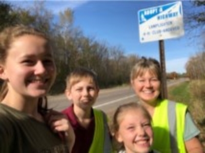 4-H family doing roadside cleanup