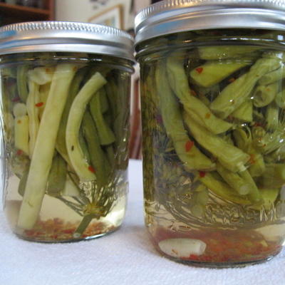 Two jars of pickled green beans.