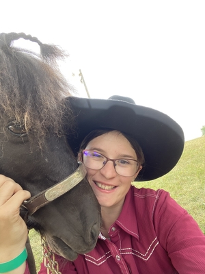 4-H'er Liberty E. taking selfie with a horse