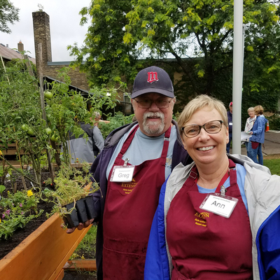 Ann Thureen and Greg Towne in front of raised garden bed