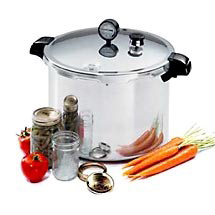 Pressure canner with jars and vegetables.