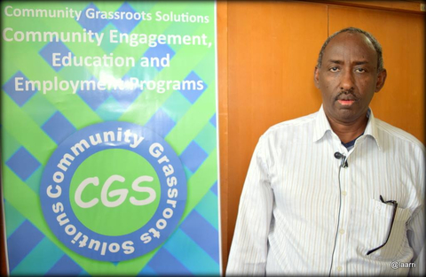 CGS executive director Abdiaziz Odiriye stands next to a CGS sign