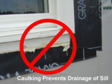 Caulking prevents drainage of sill.