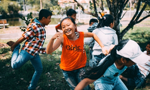 Girl running while laughing